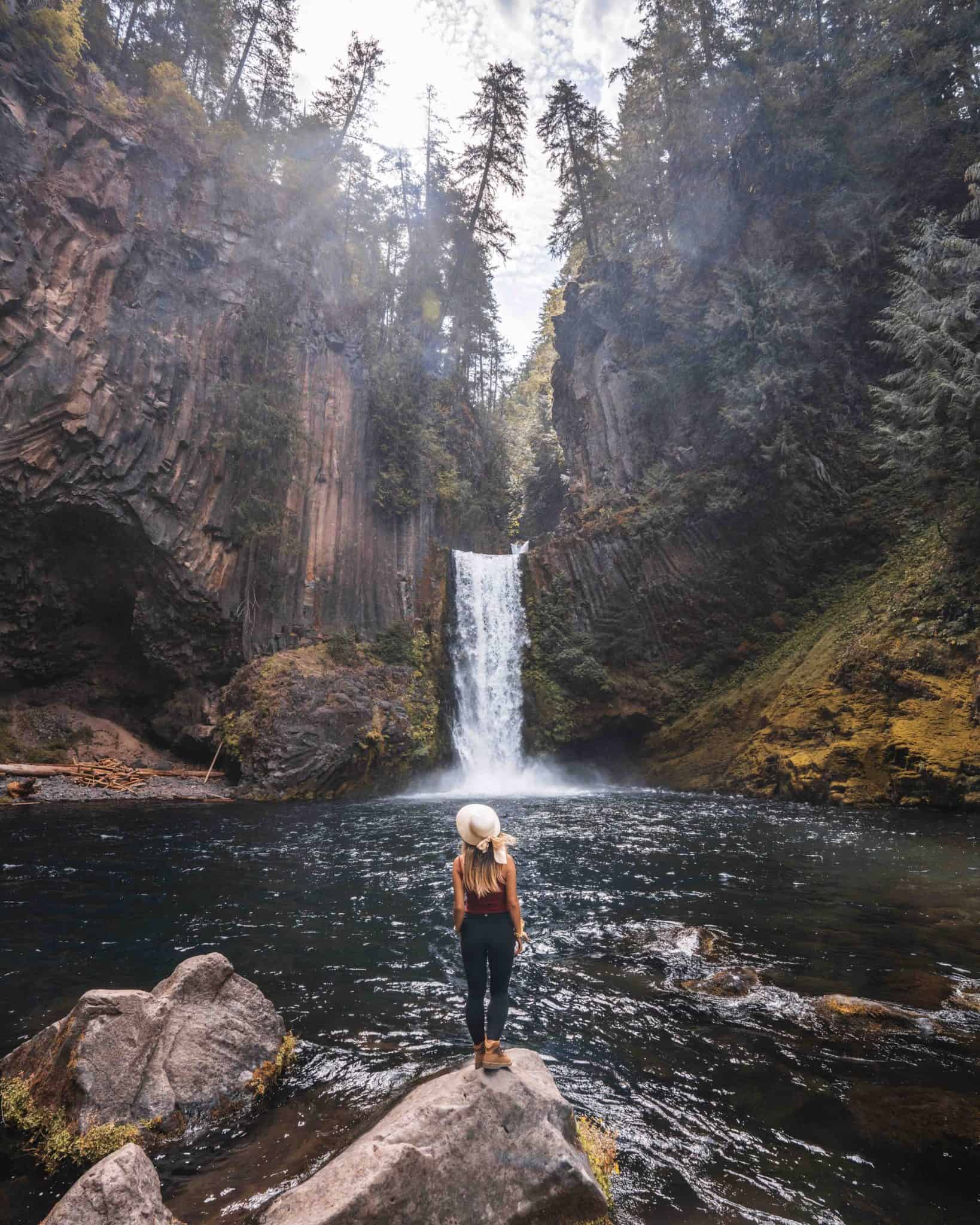 Toketee Falls framed by basalt cliffs, photographed beside the pool in August 2020