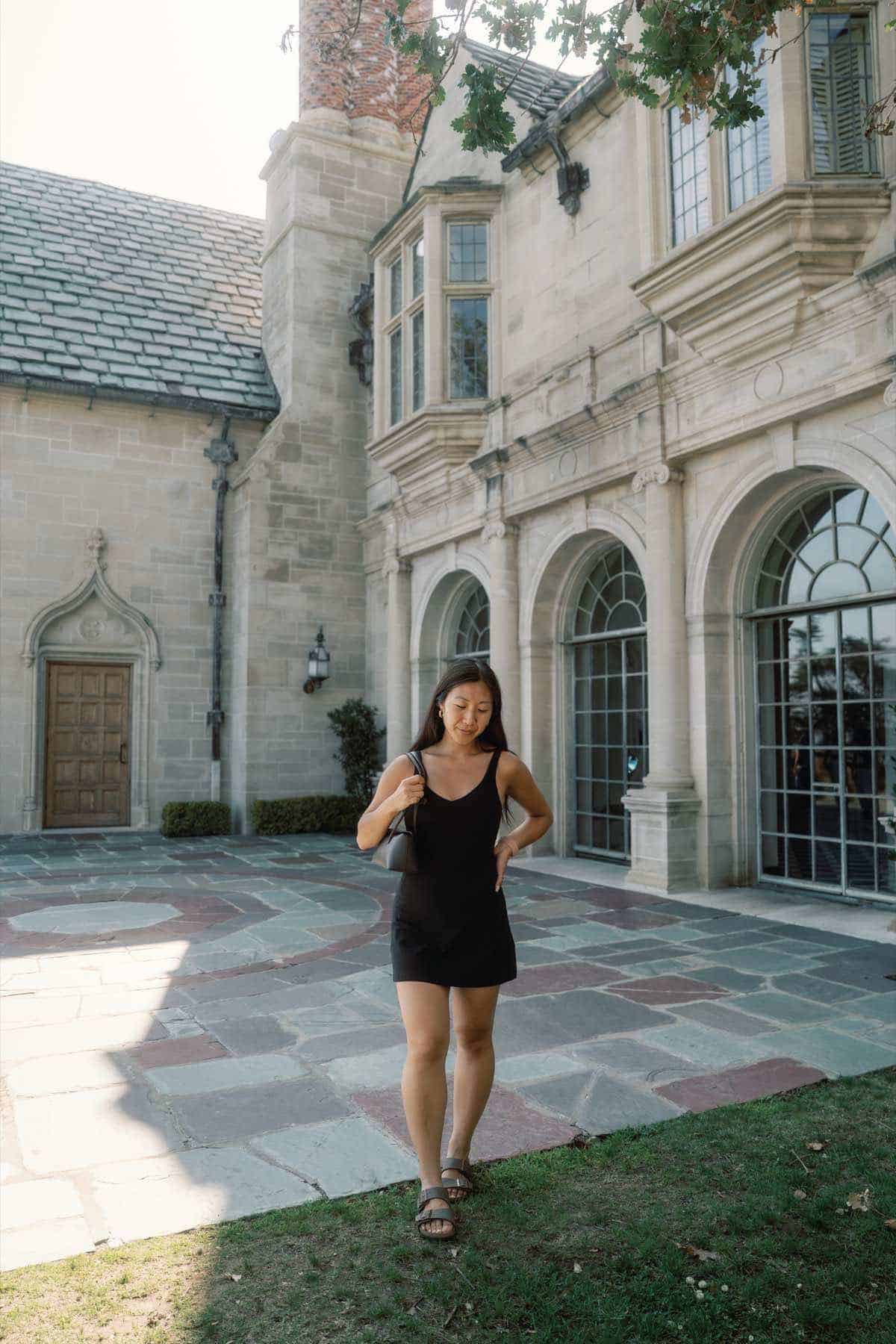 Grace Kim standing in the courtyard at Greystone Mansion in Beverly Hills