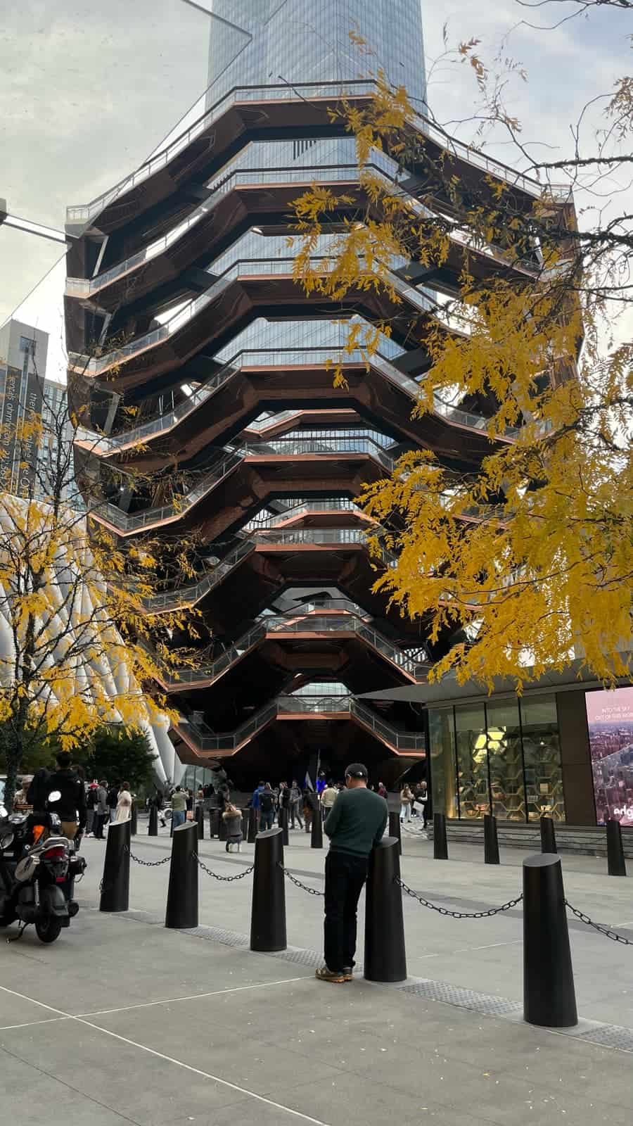 The Vessel in New York framed by yellow autumn leaves at Hudson Yards