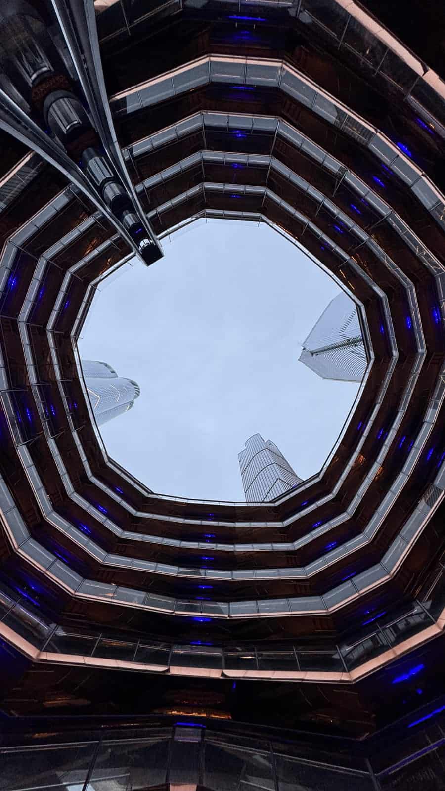 Looking up through the center of the Vessel NYC toward the sky