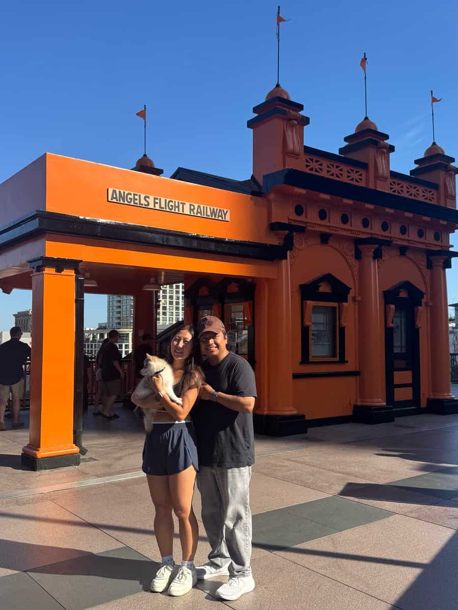 Visitors beside the orange Angels Flight entrance