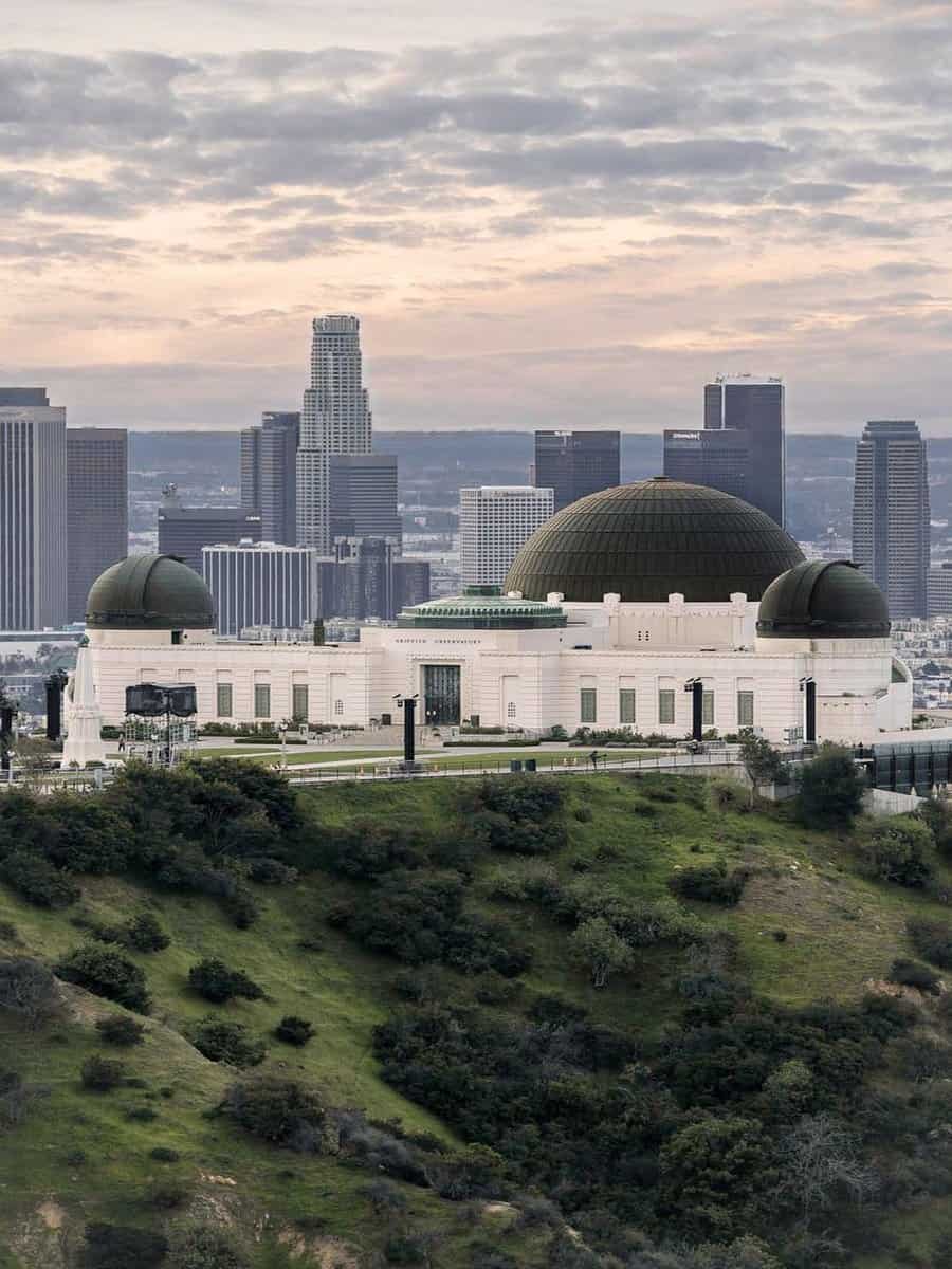 Griffith Observatory domes with the Los Angeles skyline behind them