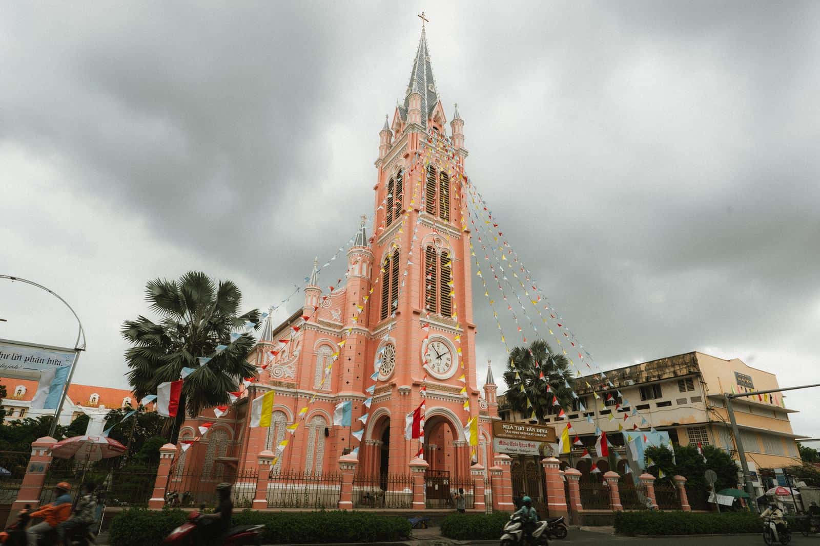 Pink facade and tall bell tower of Tan Dinh Church in Ho Chi Minh City