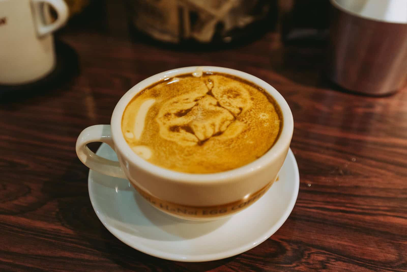 Overhead view of the creamy topping on egg coffee at Little Hanoi in Saigon