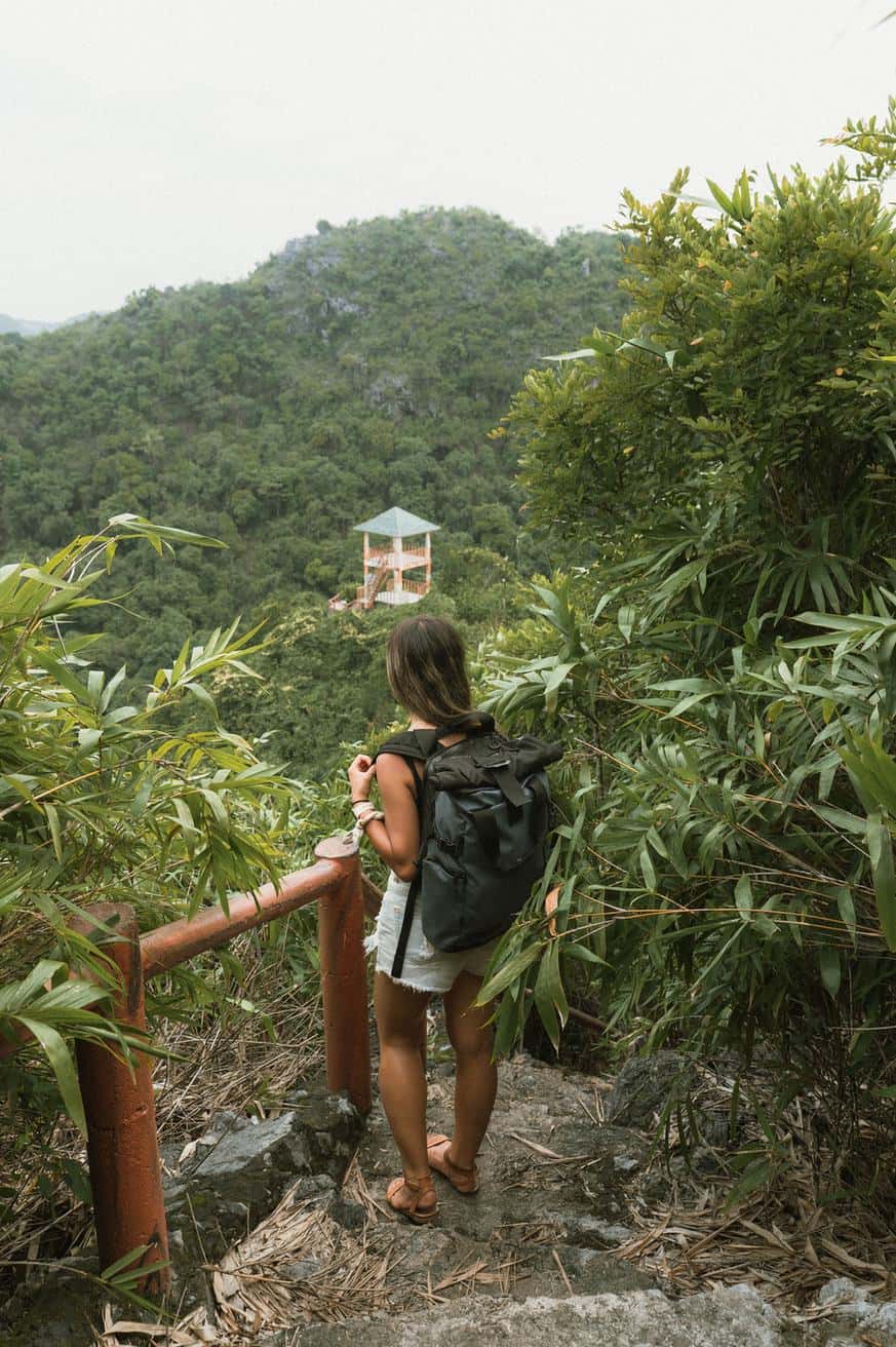 Grace beside the railing on the Ngu Lam hike in Cat Ba National Park