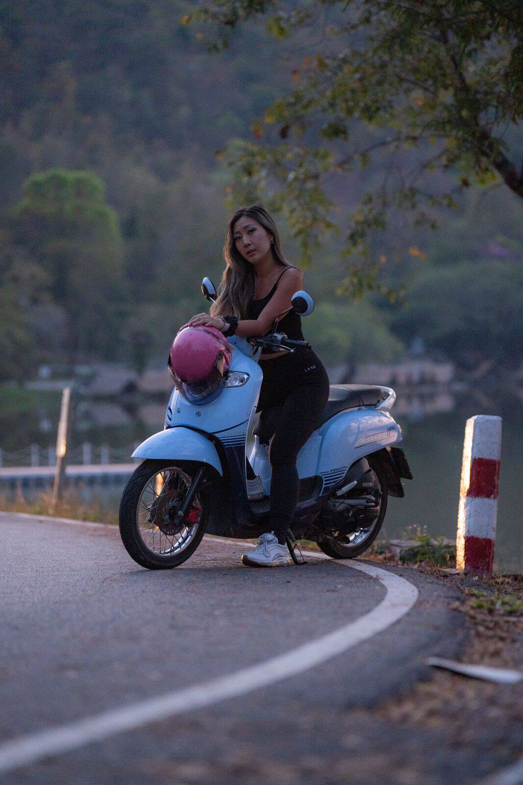 Grace with her rented scooter at Ang Kaew Reservoir, Chiang Mai